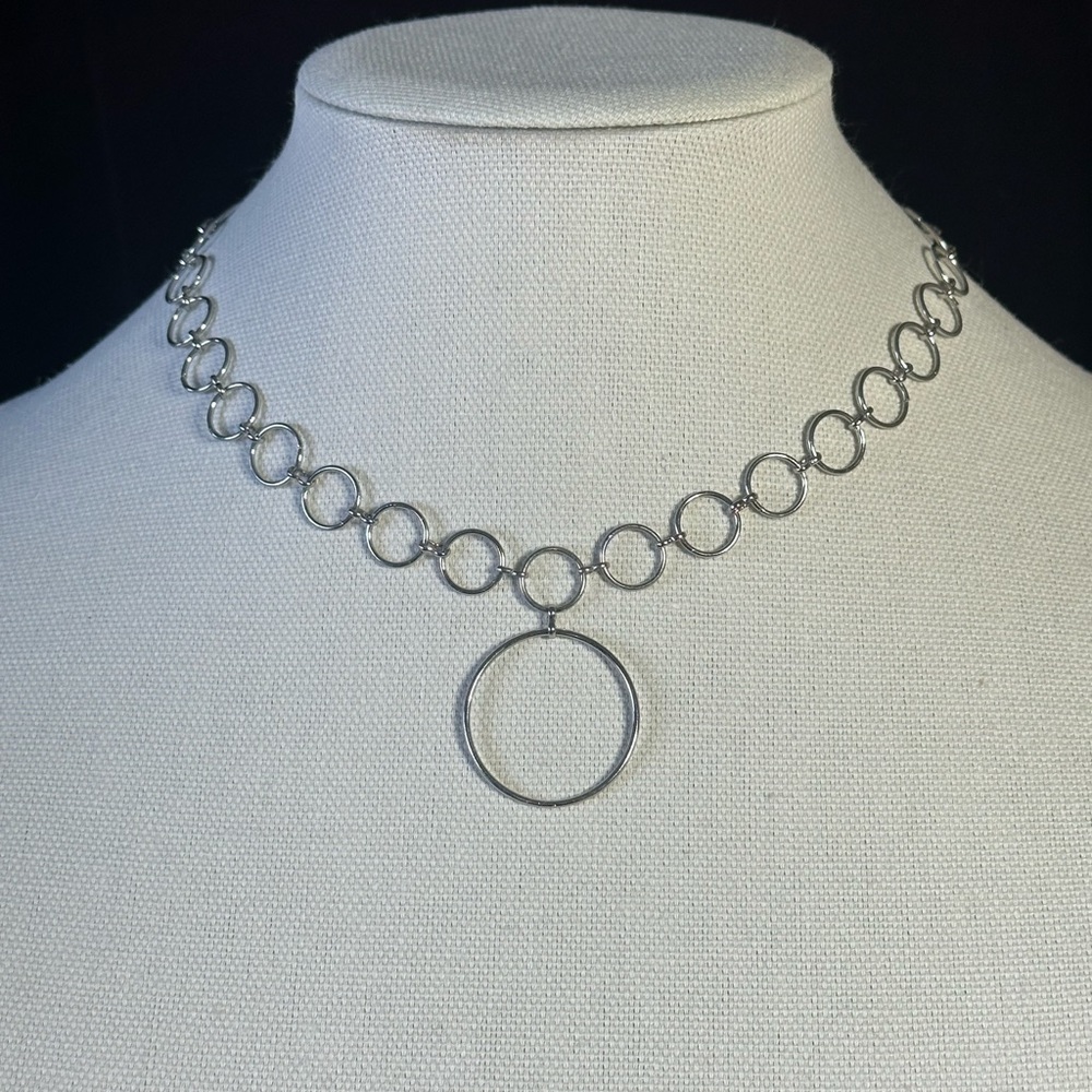 Choker necklace with circle charm.